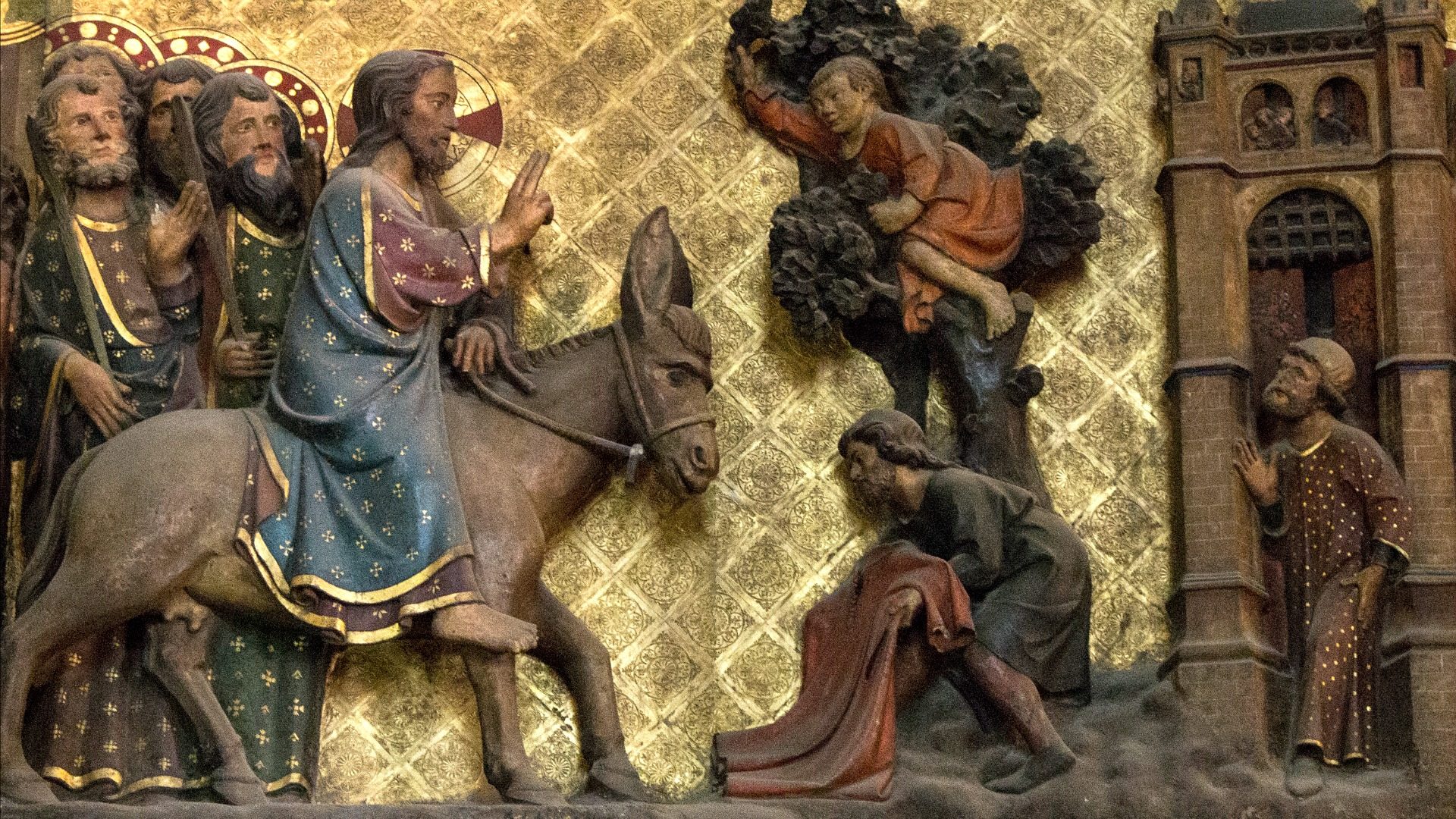 "Comme Jésus entrait à Jérusalem, toute la ville fut en proie à l’agitation, et disait : « Qui est cet homme ? » (Mt 21, 10).  Tableau en bois polychrome, détail, cathédrale Notre-Dame de Paris. (Photo: Flickr/Lawrence OP/CC BY-NC-ND 2.0)