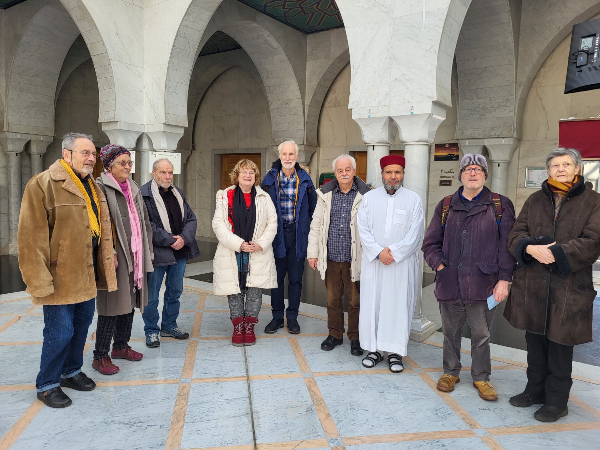 Quelques participants de "Dialogue en route" sont accueillis à la mosquée de Genève par l'imam Noureddine Fergani | © Lucienne Bittar